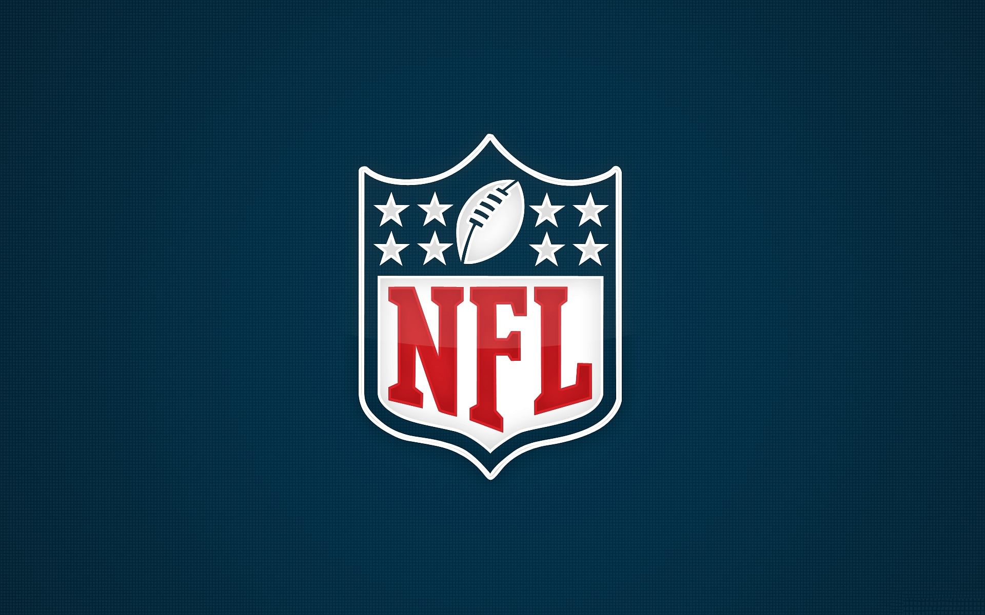 The NFL Shield / logo is seen on a blue background before an NFL